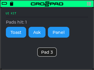 The UI Kit app: the heading UI KIT in the theme's green pixel font over a thin rule, the line "Pads hit: 1", three blue buttons Toast, Ask and Panel, and a toast reading "Pad 3" near the bottom